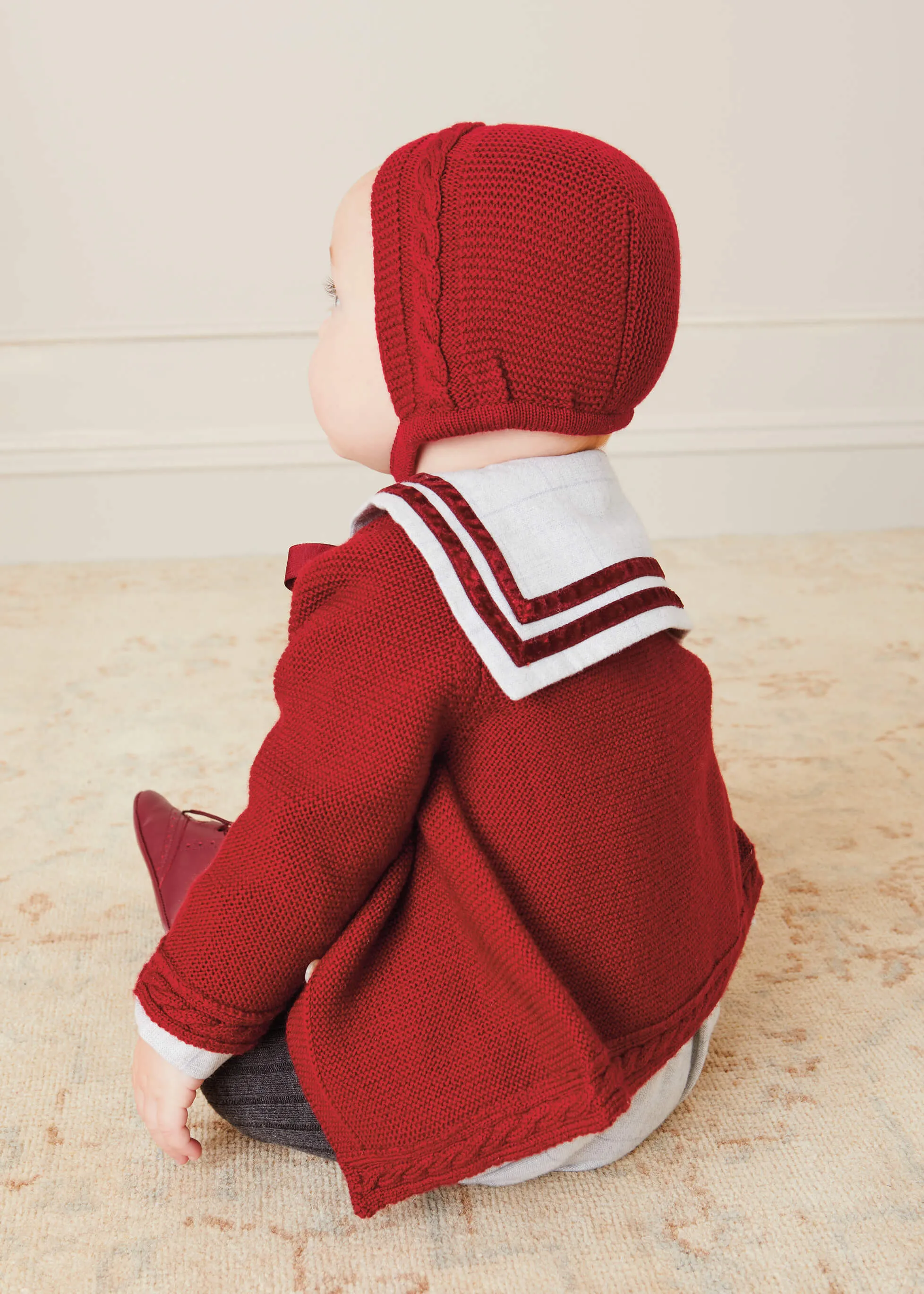 Cable Knit Red Bonnet: Sizes Small to Large.