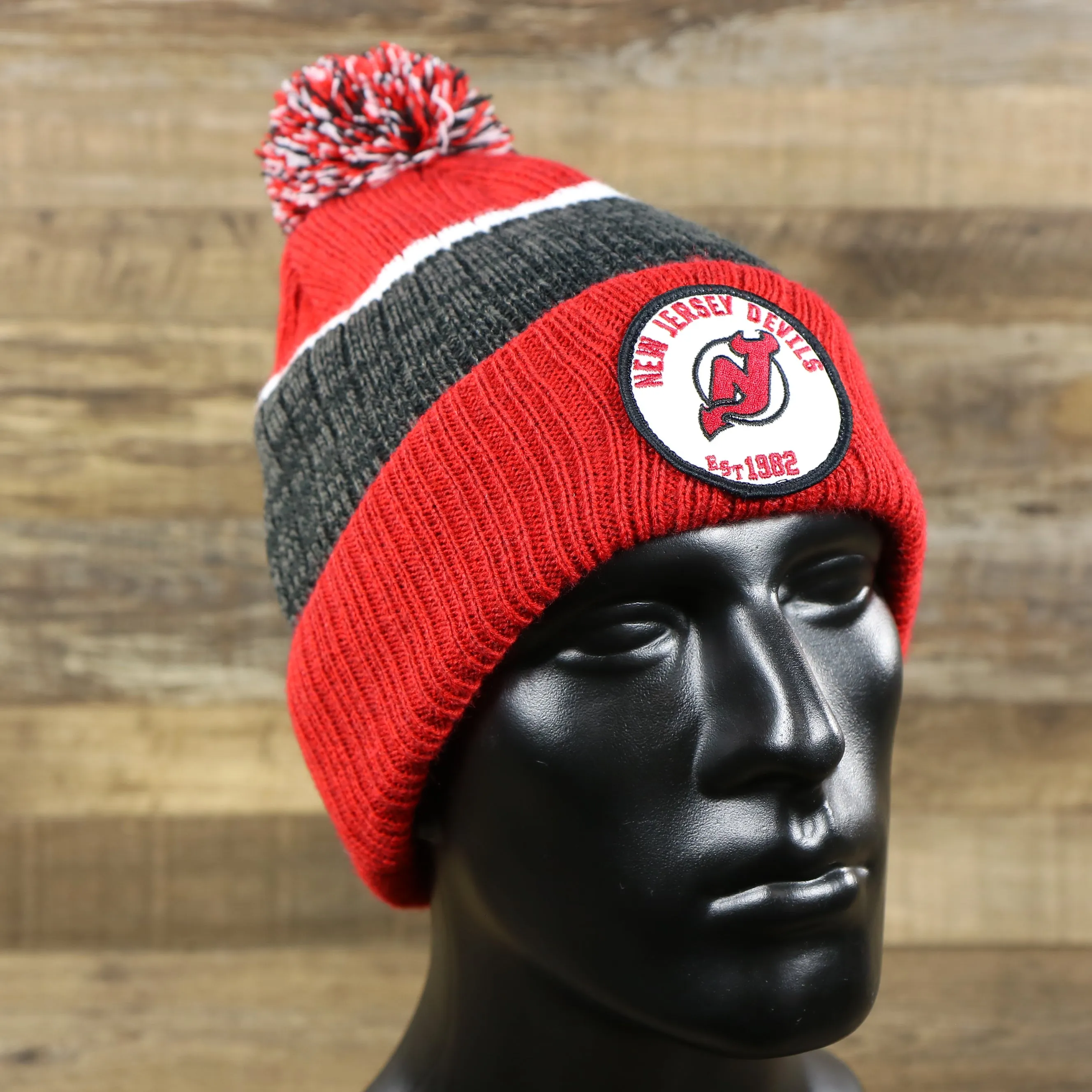 New Jersey Devils Winter Beanie - Red and Gray Striped Cuffed Pom Pom Hat