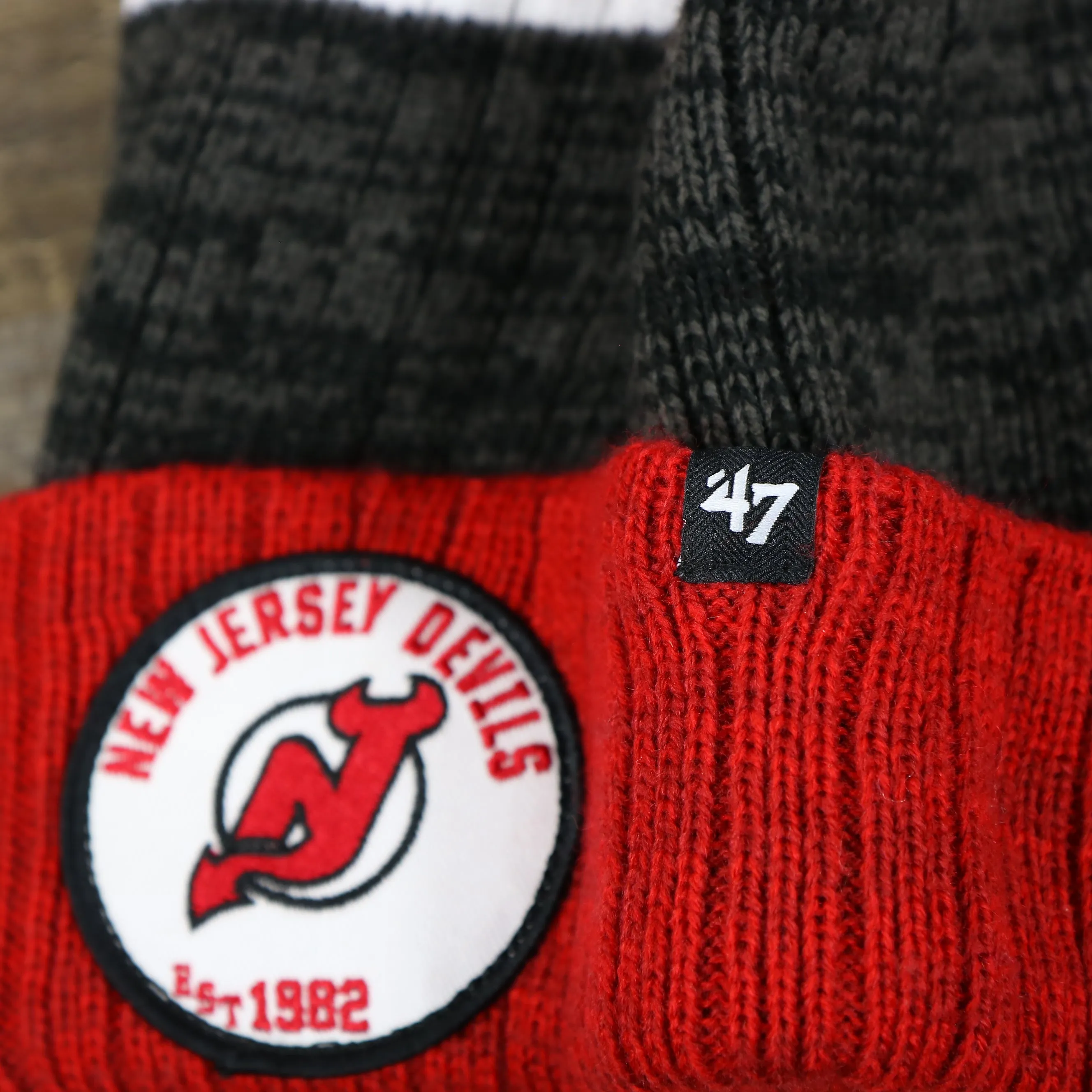 New Jersey Devils Winter Beanie - Red and Gray Striped Cuffed Pom Pom Hat