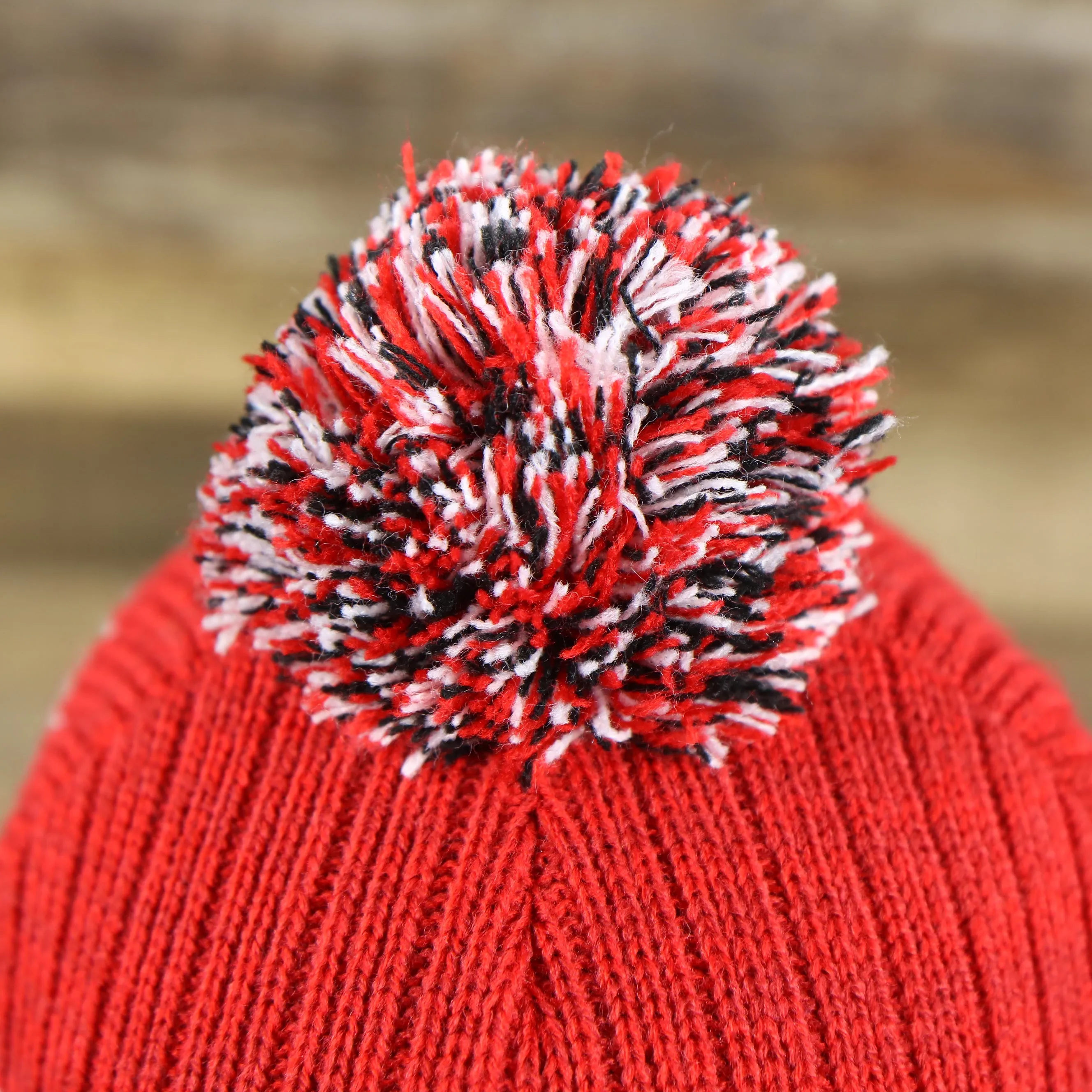 New Jersey Devils Winter Beanie - Red and Gray Striped Cuffed Pom Pom Hat